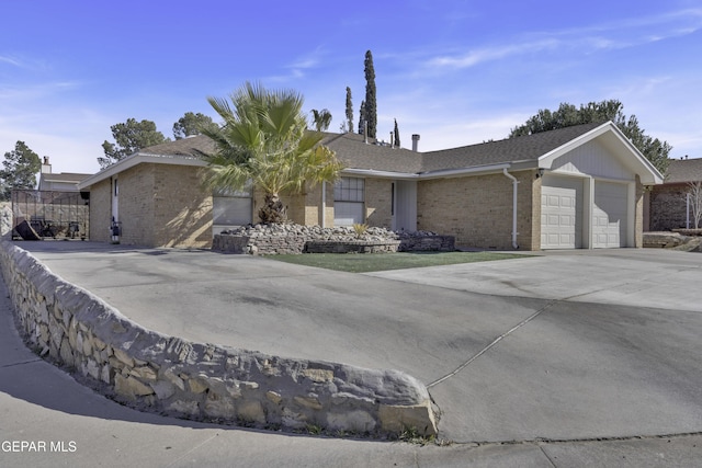 ranch-style house featuring a garage