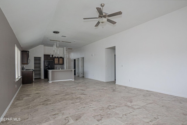 unfurnished living room featuring lofted ceiling and ceiling fan