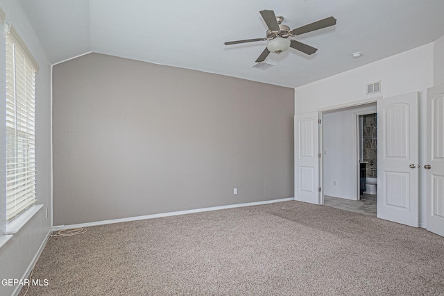 unfurnished bedroom featuring vaulted ceiling, ceiling fan, and carpet floors