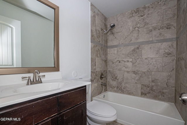 full bathroom featuring vanity, toilet, and tiled shower / bath combo