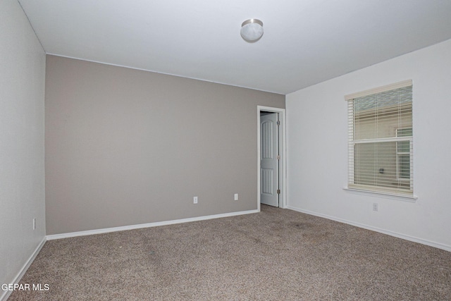 unfurnished room with carpet