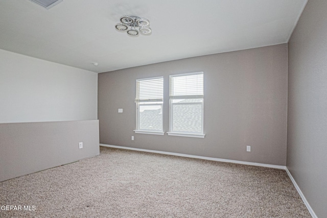 spare room featuring carpet floors