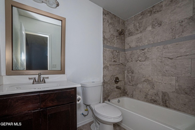 full bathroom with tiled shower / bath, vanity, and toilet