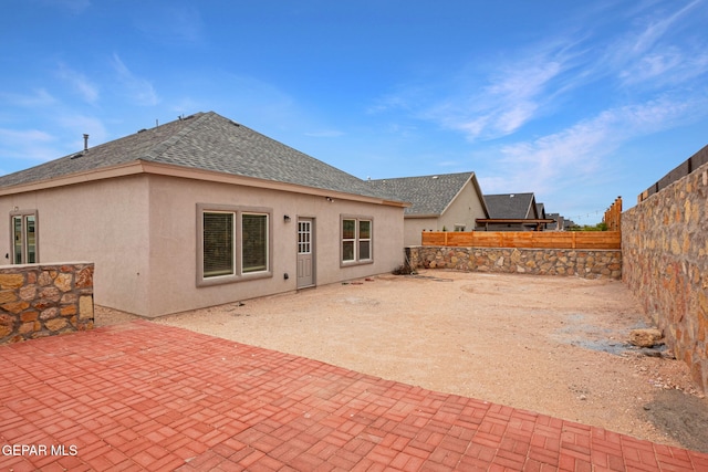 back of house with a patio area