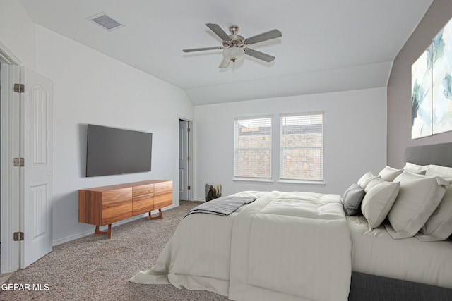 bedroom featuring ceiling fan, light colored carpet, and vaulted ceiling