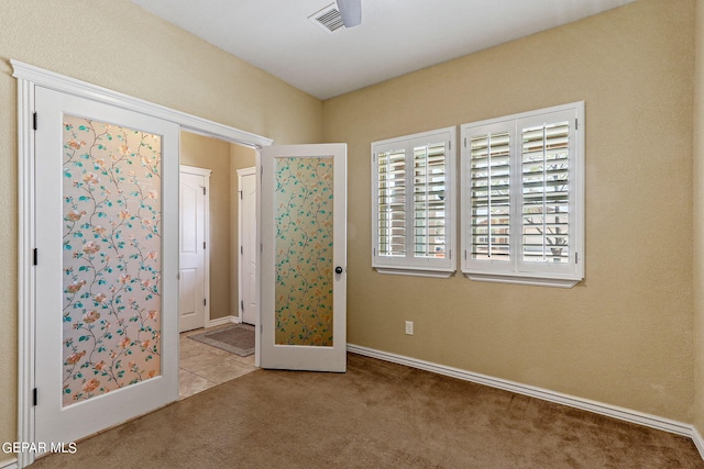 interior space featuring light carpet