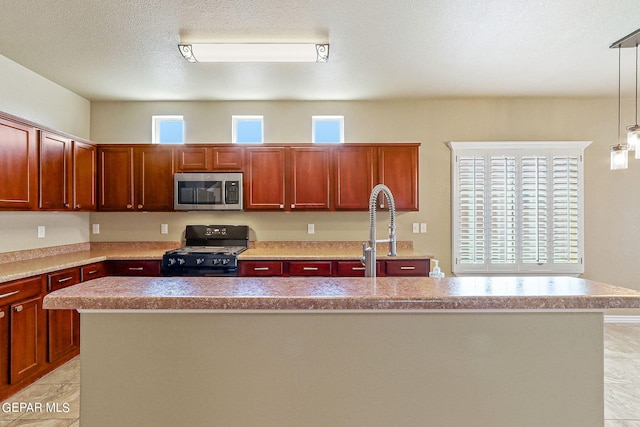 kitchen with sink, black range with gas cooktop, hanging light fixtures, a textured ceiling, and a kitchen island