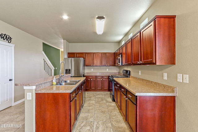 kitchen featuring sink, light tile patterned floors, stainless steel appliances, and an island with sink