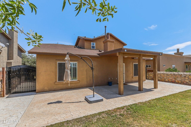 rear view of property with a patio area