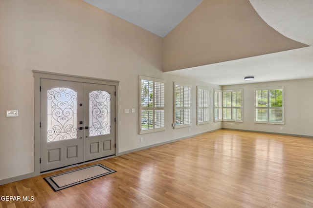 909 Singing Hills Dr, El Paso, TX 79912 - foyer entrance featuring wood finished floors, french doors, and baseboards