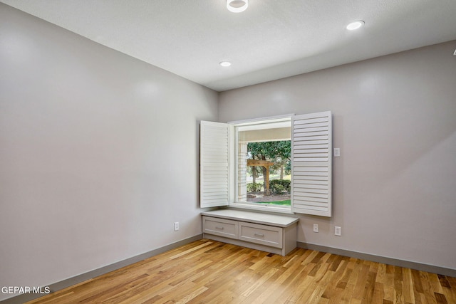909 Singing Hills Dr, El Paso, TX 79912 - empty room with light wood-style flooring, baseboards, and recessed lighting