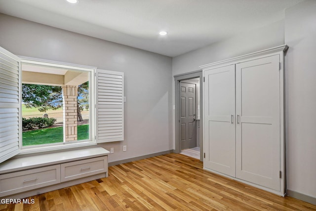 909 Singing Hills Dr, El Paso, TX 79912 - unfurnished bedroom with light wood finished floors, baseboards, and recessed lighting