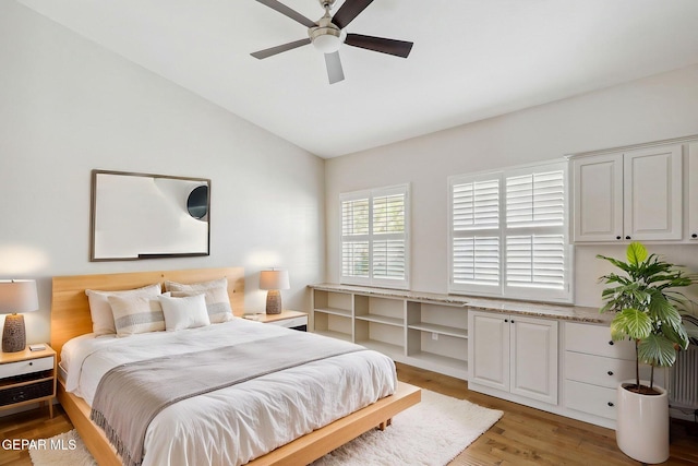 909 Singing Hills Dr, El Paso, TX 79912 - bedroom featuring lofted ceiling, light wood-type flooring, and a ceiling fan