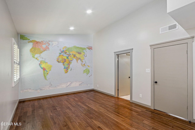 909 Singing Hills Dr, El Paso, TX 79912 - unfurnished bedroom with wood finished floors, lofted ceiling, baseboards, and recessed lighting