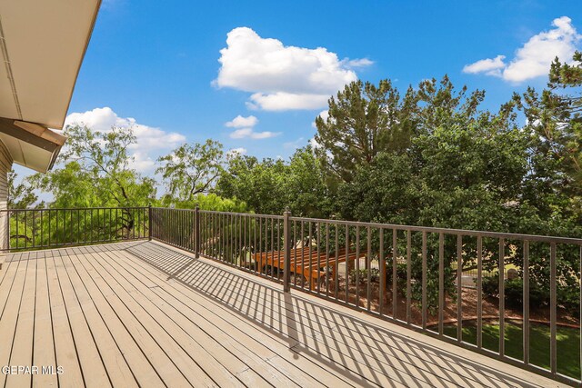 909 Singing Hills Dr, El Paso, TX 79912 - wooden deck with view of scattered trees