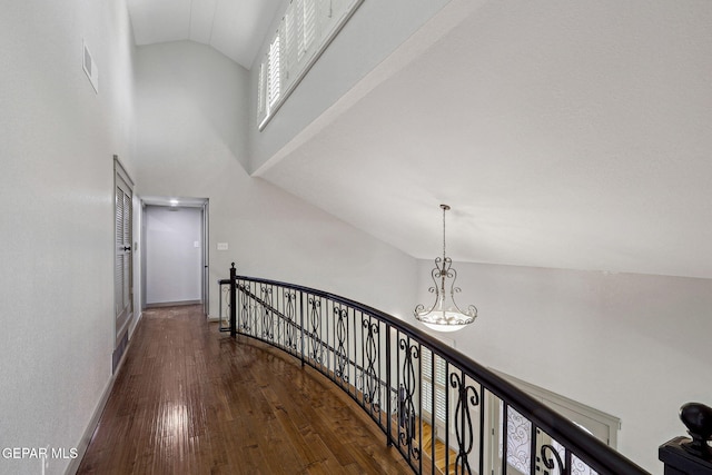909 Singing Hills Dr, El Paso, TX 79912 - hallway with an upstairs landing, hardwood / wood-style floors, baseboards, and high vaulted ceiling