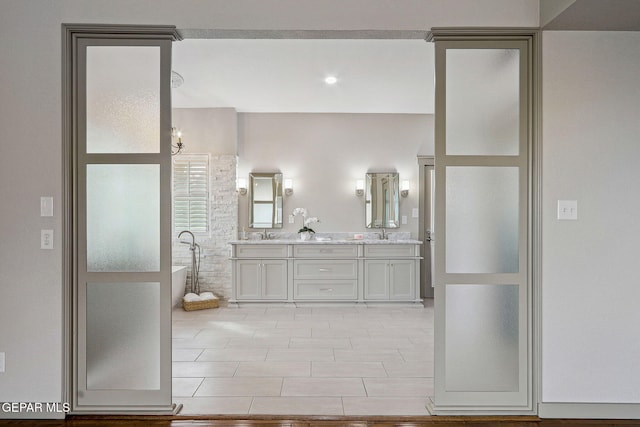 909 Singing Hills Dr, El Paso, TX 79912 - full bathroom with a freestanding bath and double vanity