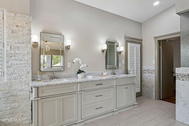 909 Singing Hills Dr, El Paso, TX 79912 - full bath featuring tile patterned flooring and double vanity