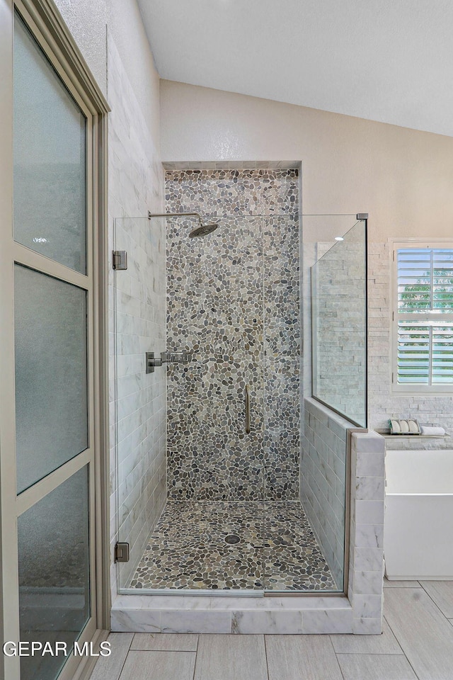 909 Singing Hills Dr, El Paso, TX 79912 - full bath with a stall shower, tile patterned flooring, and a bath