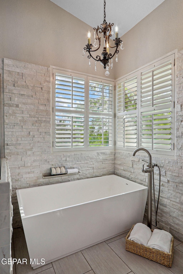 909 Singing Hills Dr, El Paso, TX 79912 - bathroom with a chandelier and a soaking tub