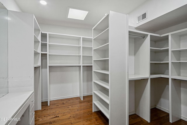 909 Singing Hills Dr, El Paso, TX 79912 - walk in closet with dark wood-type flooring