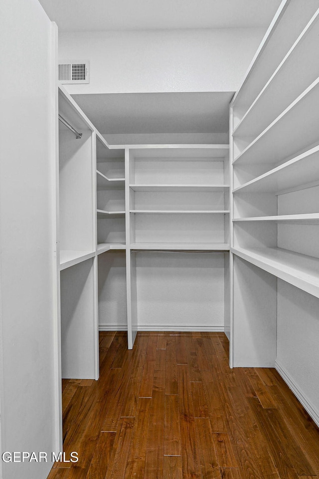 909 Singing Hills Dr, El Paso, TX 79912 - spacious closet with dark wood-style floors