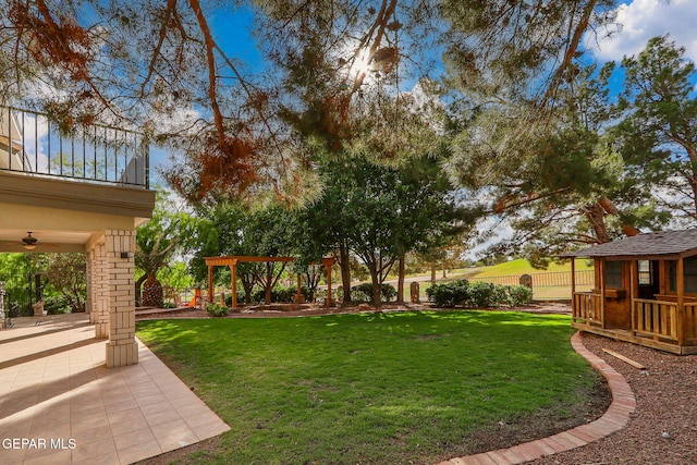 909 Singing Hills Dr, El Paso, TX 79912 - view of yard featuring ceiling fan, a patio, and a balcony