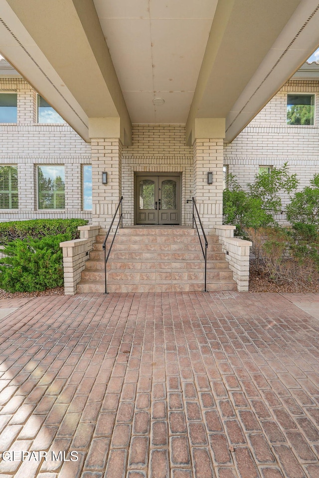 909 Singing Hills Dr, El Paso, TX 79912 - view of patio featuring french doors