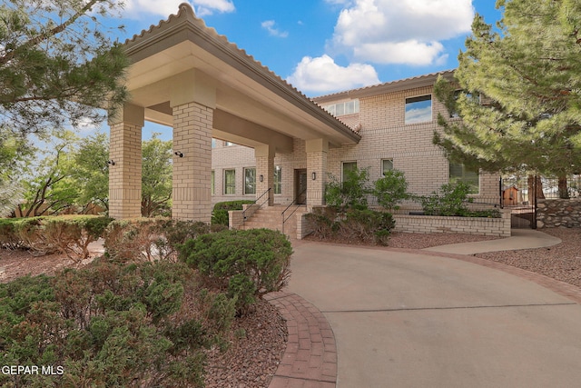 909 Singing Hills Dr, El Paso, TX 79912 - view of front of property featuring brick siding and a tiled roof