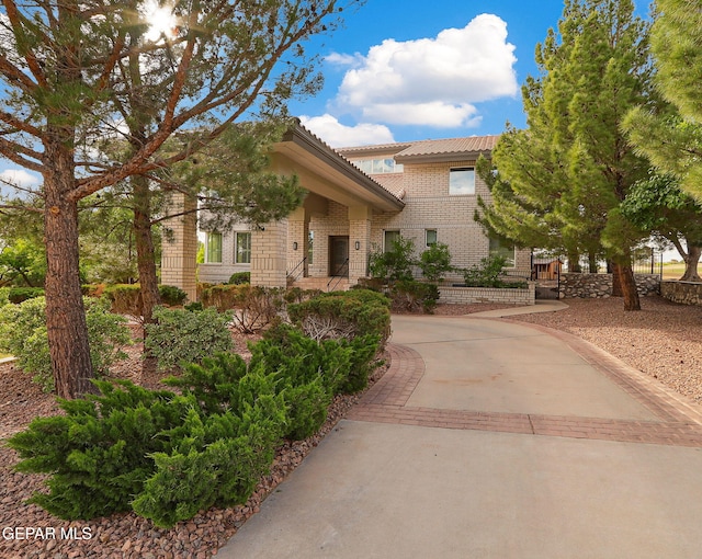 909 Singing Hills Dr, El Paso, TX 79912 - view of front of property with a tile roof and brick siding