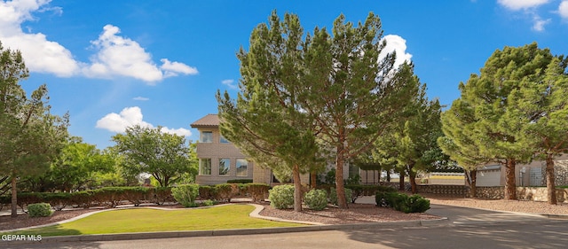 909 Singing Hills Dr, El Paso, TX 79912 - view of property hidden behind natural elements with a front yard