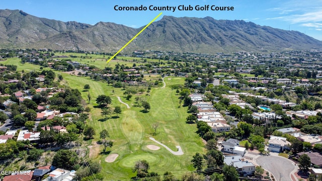 909 Singing Hills Dr, El Paso, TX 79912 - aerial view of property's location with a mountain backdrop, a local golf course, and nearby suburban area