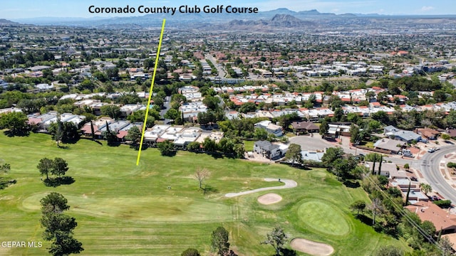 909 Singing Hills Dr, El Paso, TX 79912 - aerial overview of property's location with mountains, nearby suburban area, and a local golf course