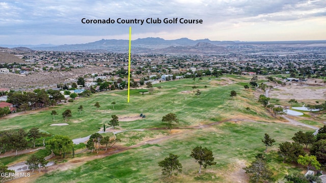 909 Singing Hills Dr, El Paso, TX 79912 - aerial overview of property's location with a mountain backdrop, a golf course, and nearby suburban area