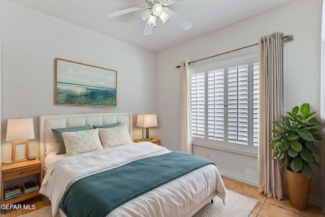 bedroom with tile patterned floors and ceiling fan