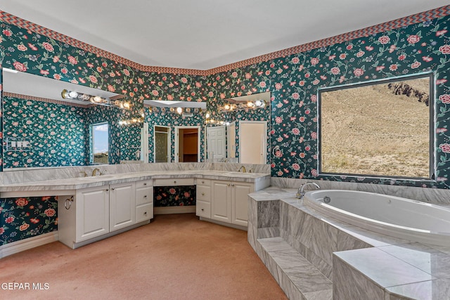 full bathroom with wallpapered walls, vanity, and a garden tub
