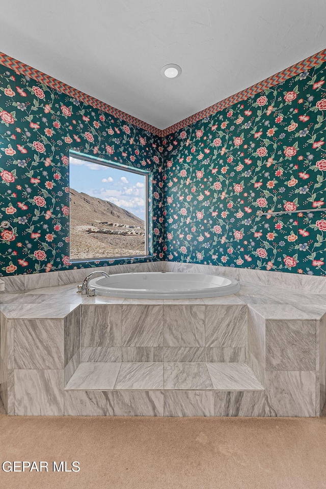 full bath featuring wallpapered walls and a garden tub