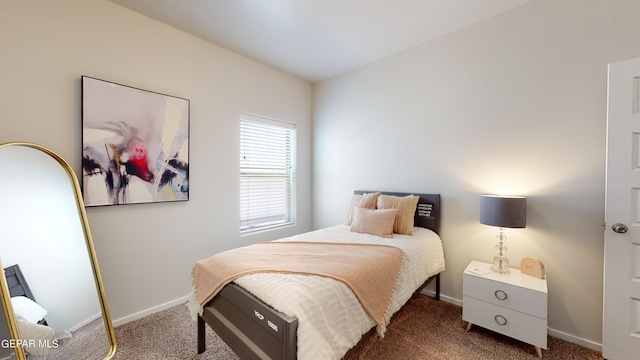 bedroom featuring dark colored carpet