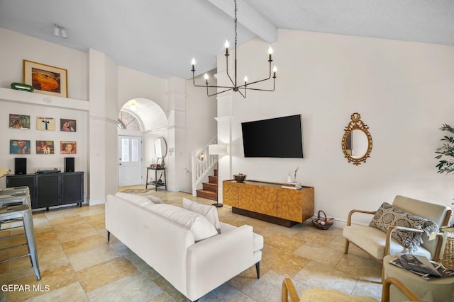 living room featuring beam ceiling and high vaulted ceiling