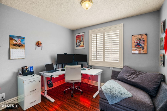 office space featuring dark hardwood / wood-style floors and a textured ceiling