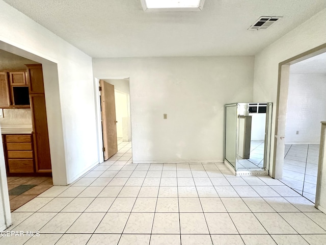 view of tiled spare room