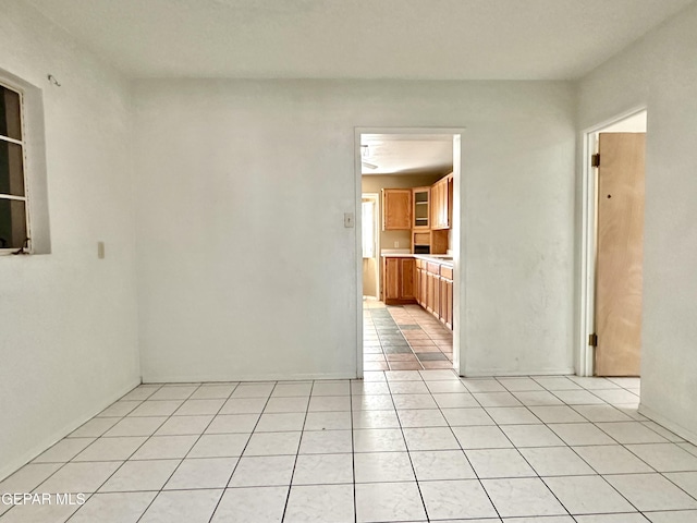 empty room featuring light tile patterned floors