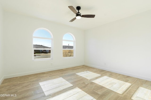 unfurnished room with ceiling fan and light hardwood / wood-style floors