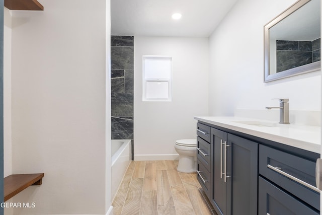 full bathroom featuring vanity, toilet, and tiled shower / bath combo