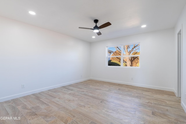 spare room featuring ceiling fan and light hardwood / wood-style floors