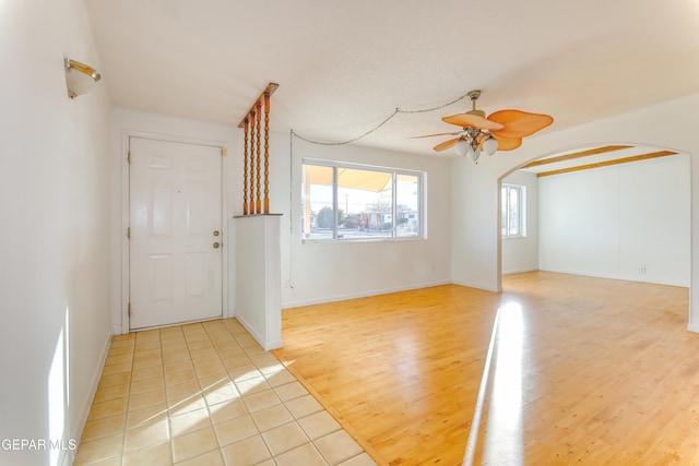 interior space with ceiling fan and light wood-type flooring