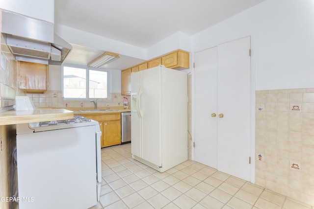 kitchen with sink, white appliances, tile walls, light tile patterned flooring, and exhaust hood