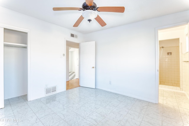 unfurnished bedroom featuring ceiling fan, connected bathroom, and a closet