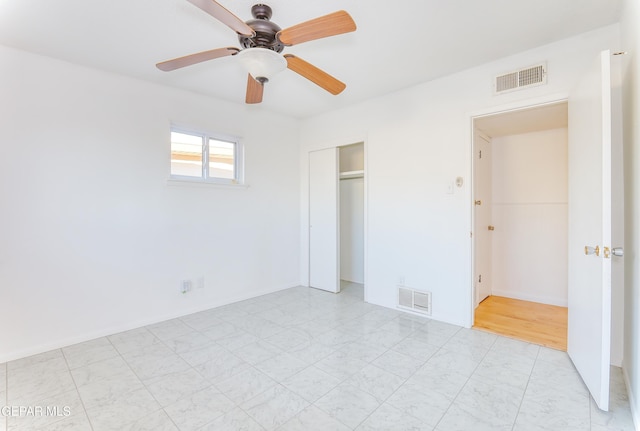 unfurnished bedroom with a closet and ceiling fan