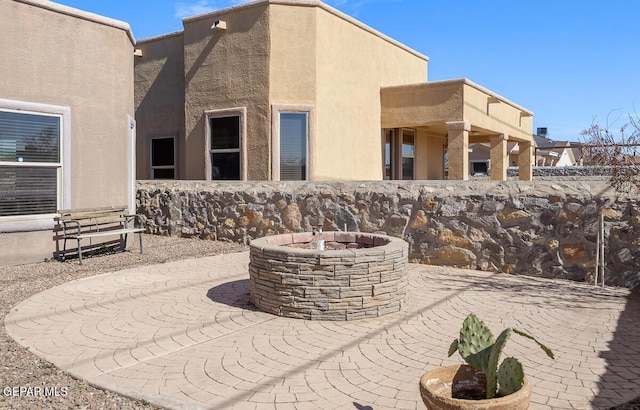 view of patio / terrace featuring a fire pit